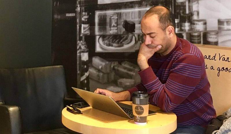 Getting clients for a cleaning business can be done right from your laptop, just like this professional cleaner.