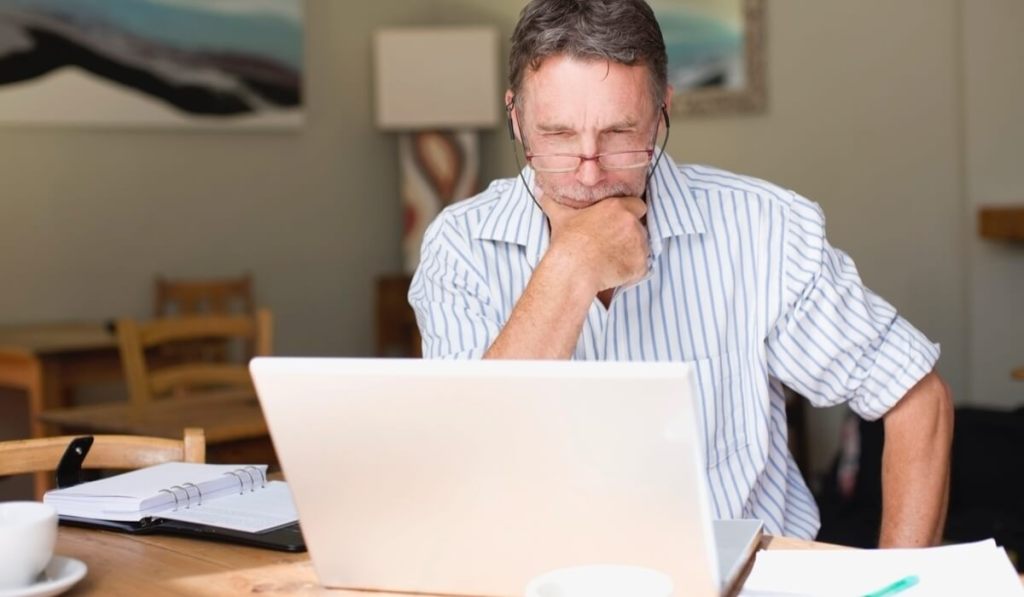 Getting a business bank account means you can have more control over your money, like this entrepreneur at his desk.