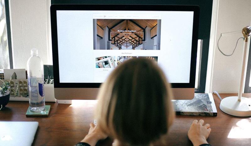 User-friendly websites for small business owners should be clean and simple, like this website on her computer screen.