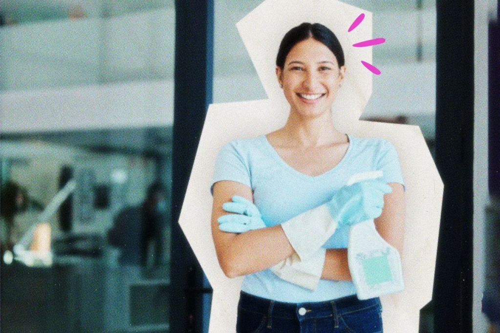 Smiling housekeeper with a spray bottle