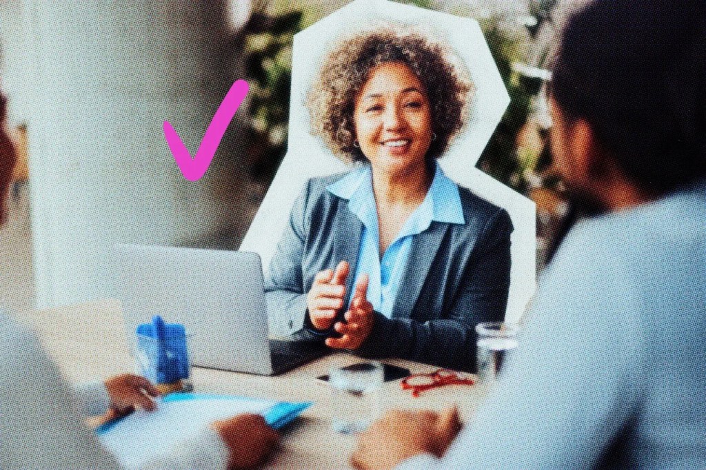 Smiling insurance agent sitting with clients.