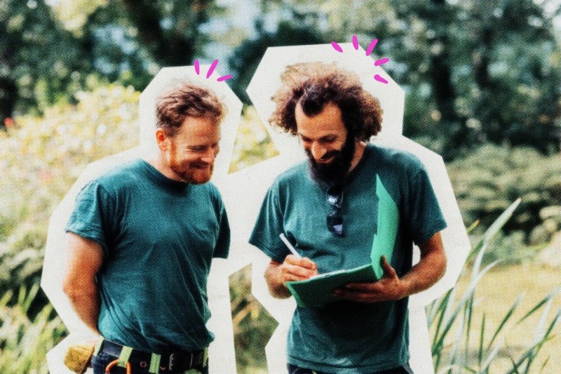 Two landscapers consulting with each other