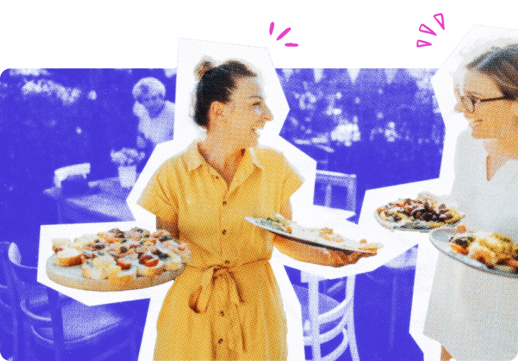 Two caterers holding trays of food.