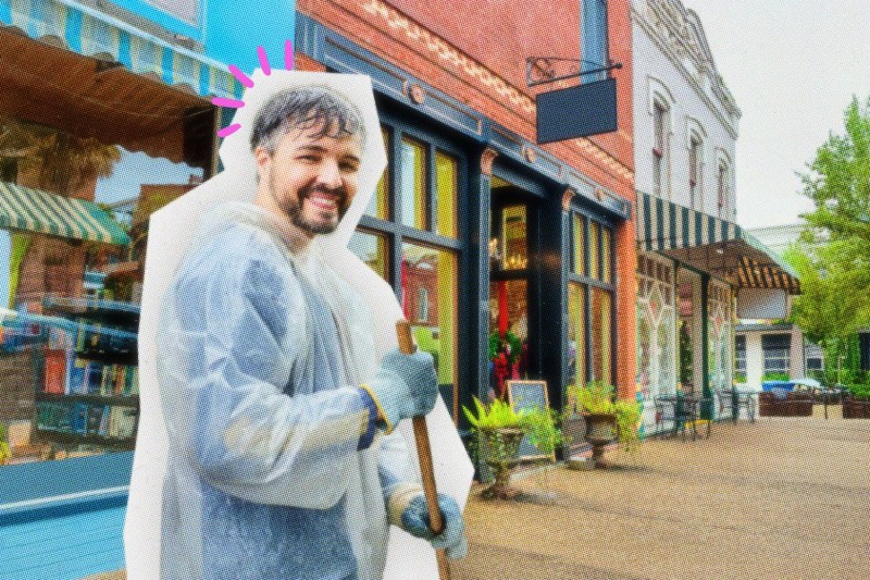 Man preparing a storefront for severe weather