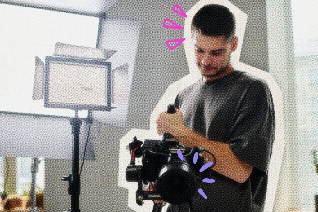 Videographer working on his camera in a studio