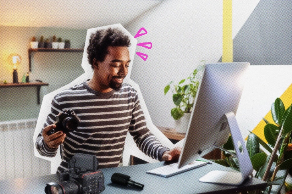Videographer working on a computer.