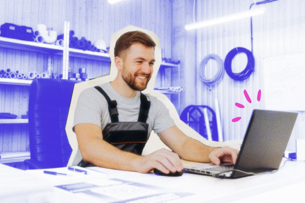 Plumber at a desk working on a laptop