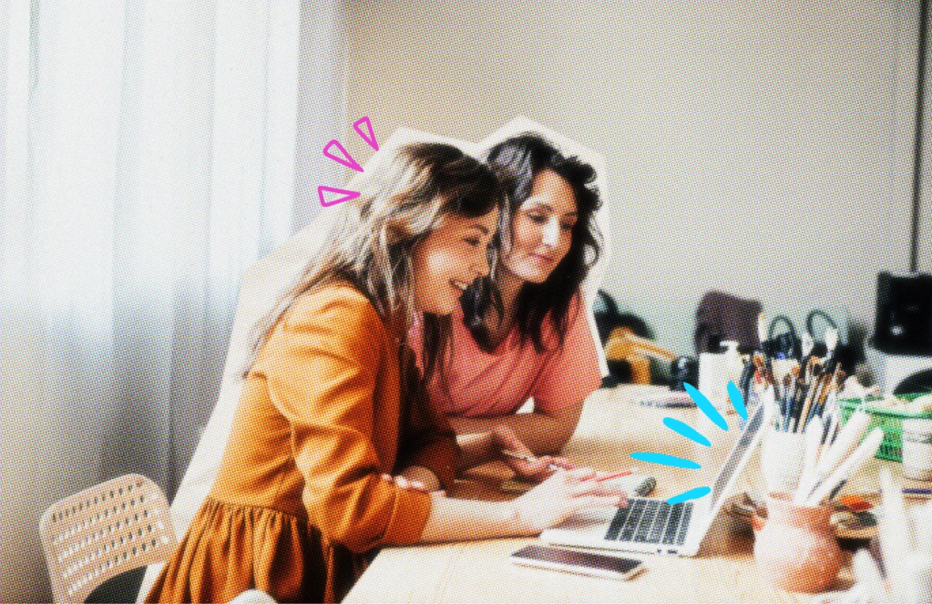 Two business owners at a laptop working on an email