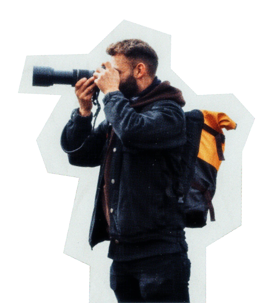 Photographer holding camera up to his face