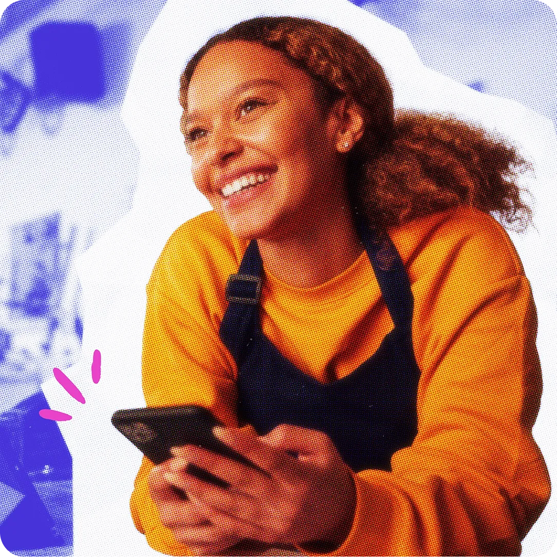 Smiling woman holding her phone