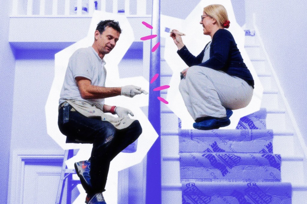 Two painters painting a railing.