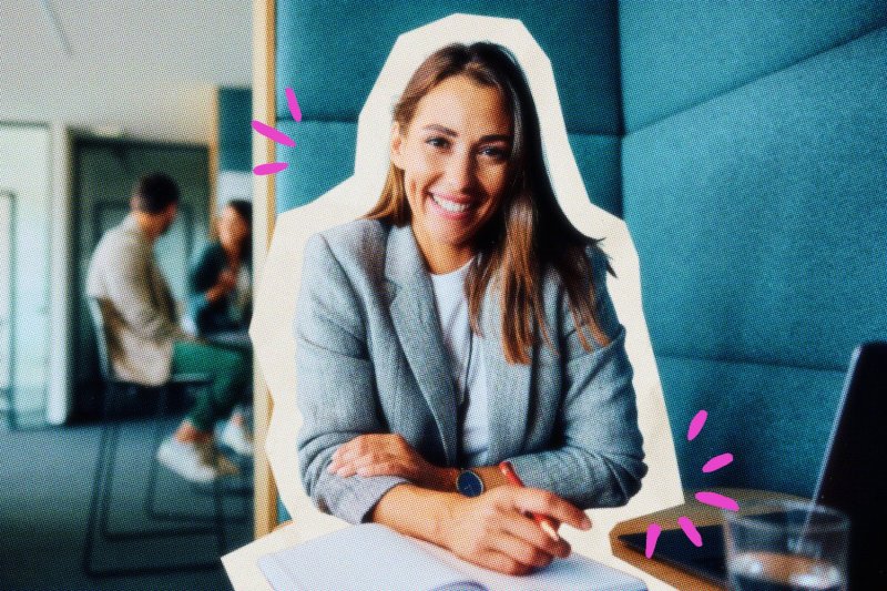 Smiling business owner working on her laptop.