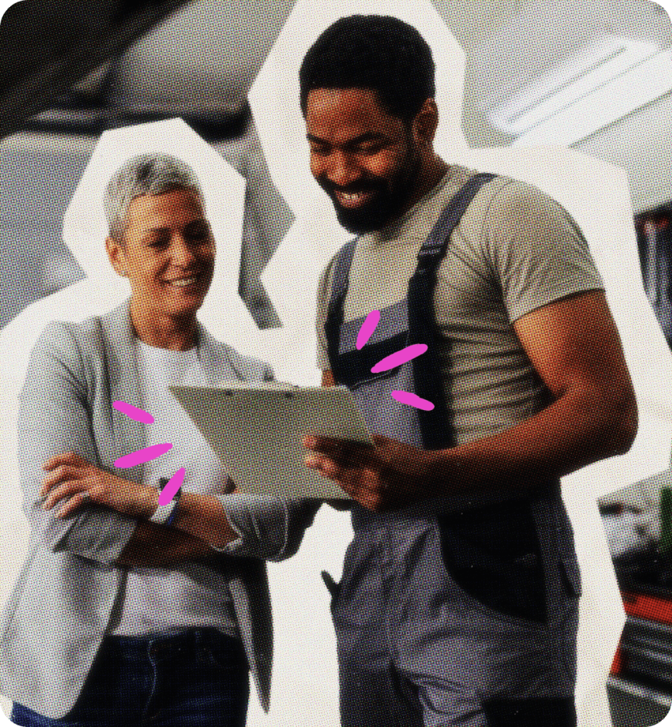 Two people look at a tablet device together.