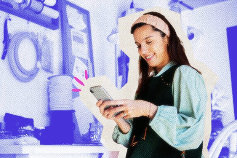 Solopreneur looking at her phone.