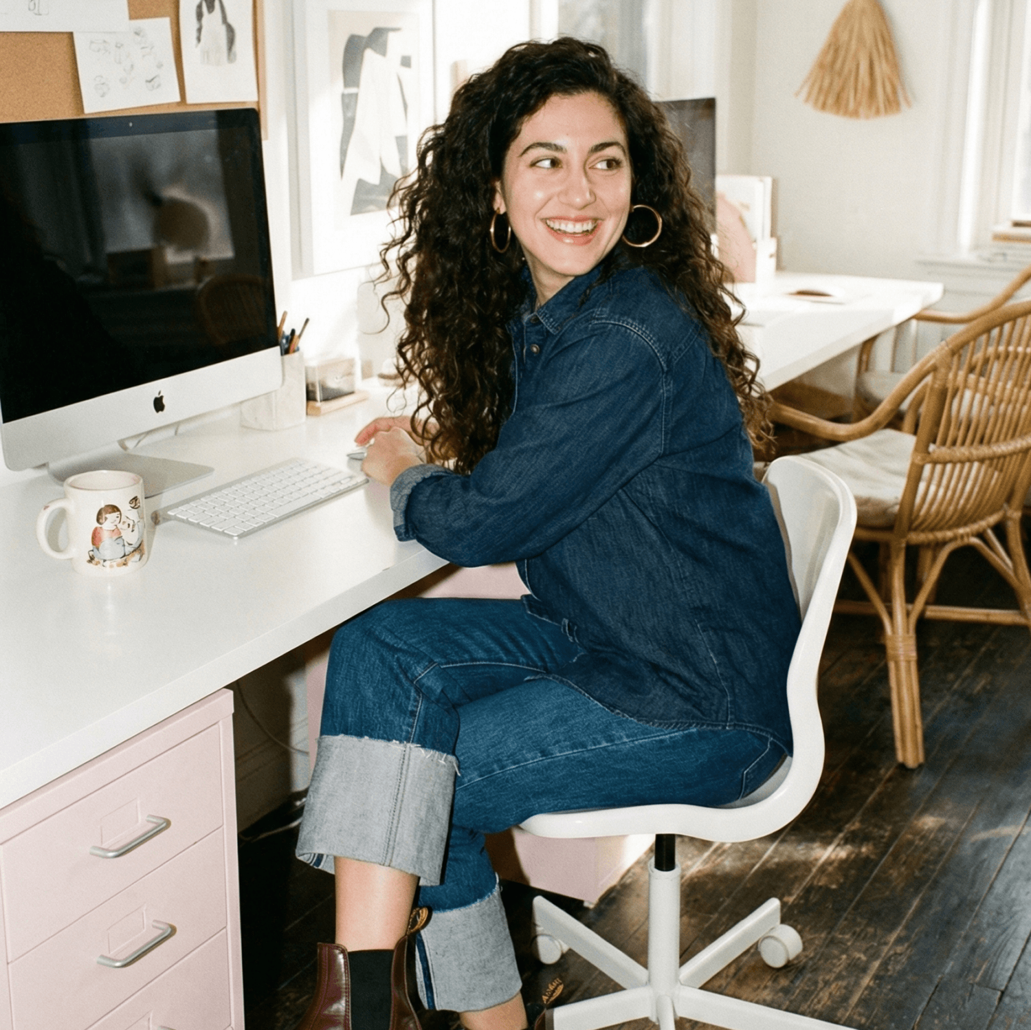 Happy woman working at an advertising agency.